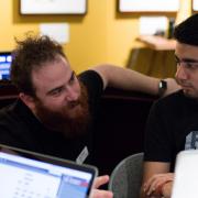 Assistant Professor Ben Shapiro helps a student.