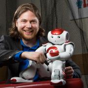 Photo of Dan Szafir with robot