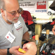 Wayne Seltzer helps someone at a fix-it clinic