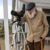 Dale Hatfield uses a scope for birdwatching