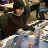 Annie Kelley works on a keyboard attached to her computer during the MakeCode workshop.