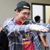 student using wearable technology laughing