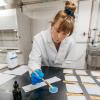 Fiona Bell applies nanocoating to fabric with brush