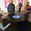 Museum visitors interact with Gallagher's Ghost exhibit