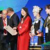 Ellen Do smiles next to several other Innovative Design recipients as she receives her award.