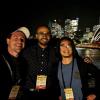 Hopkins, Vanukuru and Weng standing beside Sydney Harbor