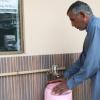 Man getting water from Water ATM