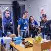 Fetch, a four-foot-tall robot is shown to attendees of the ATLAS Research Showcase.