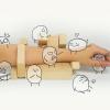 An arm with illustrations added of different emotions, symbolizing the emotional effect of touch.