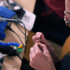 Professor Devendorf soldering and weaving