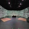 Sonic Summit stage setup with illustration of speaker around in 270-degree surround theater
