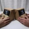two cardboard tinycades side by side