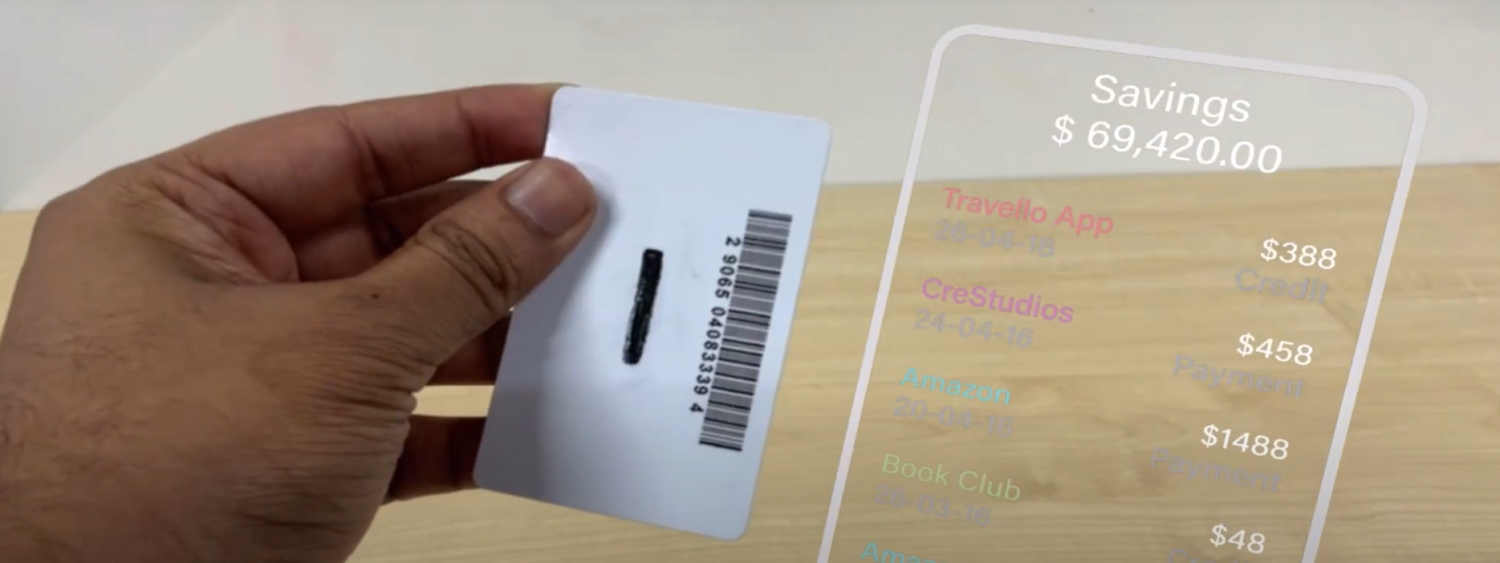 A person holding a card and showing the back. A digital overlay on the right side of the card shows savings and recent expenses.