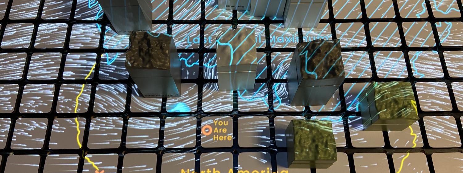 3d blocks of topography laid out on a grid with a projection on top