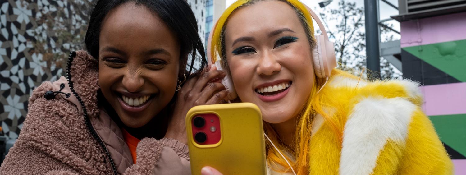 Two young people listening to music together
