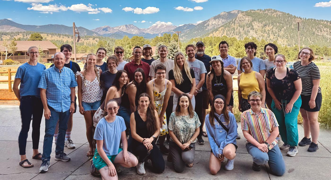 people in front of mountains