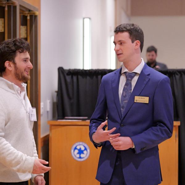 Joe Muckle and Dan Hoffman from the Chancellor's Office chat during reception