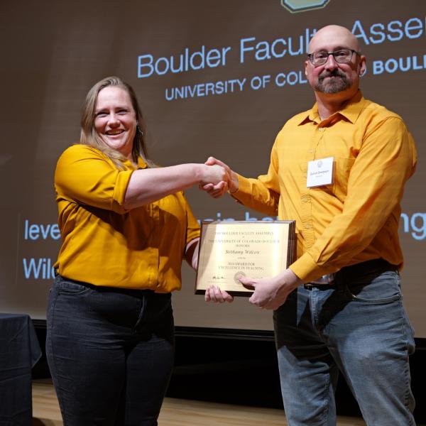 Excellence in Teaching Awardee Bethany Wilcox and Selection Committee Chair Garrett Bredeson