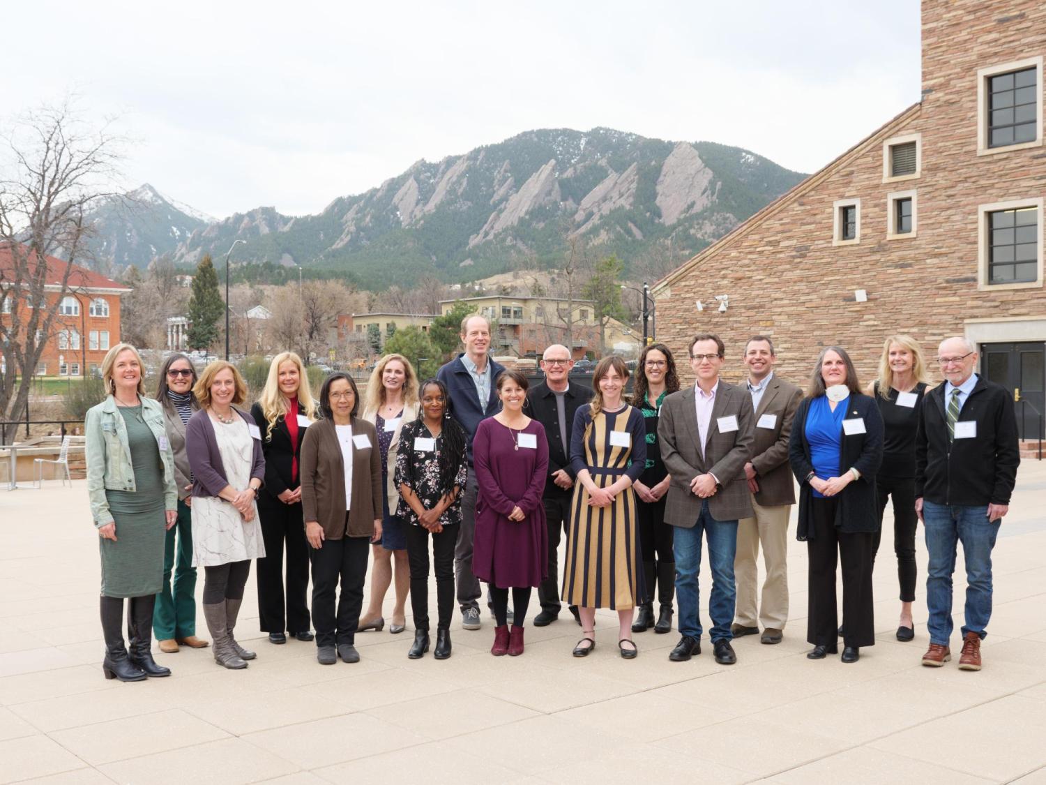 Excellence Award winners on UMC patio flatirons background