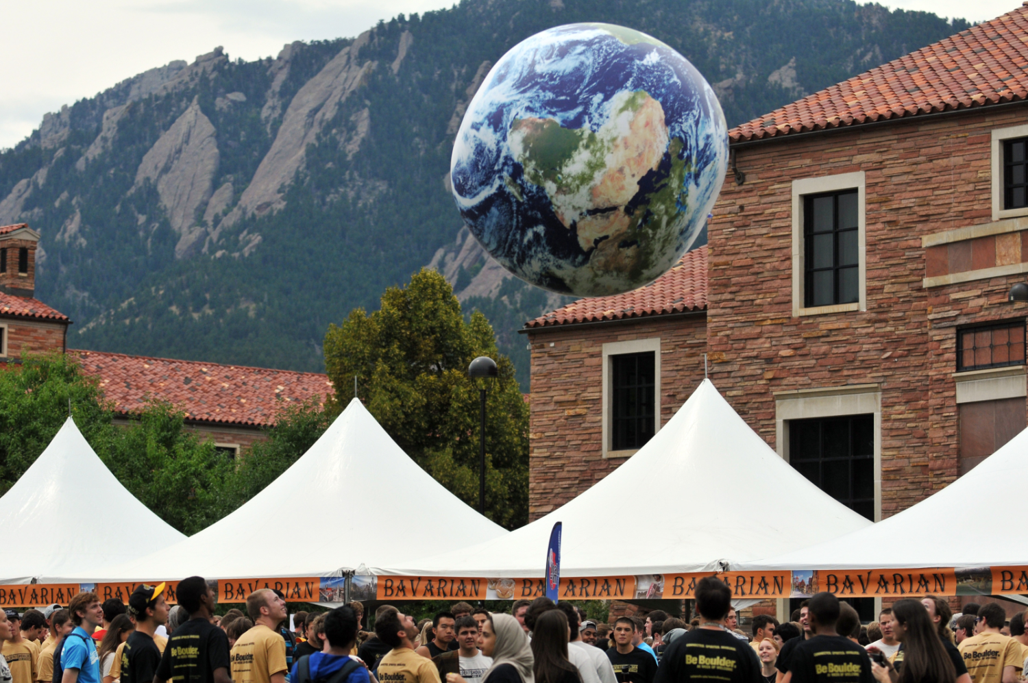 Beach Ball textured as earth is bounced in a crowd