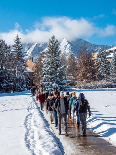 Students walking on campus in the snow