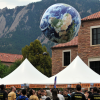 Beach Ball textured as earth is bounced in a crowd