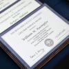 Leadership award winners plaques on a blue tablecloth