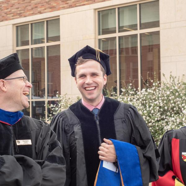 Biochemistry Faculty and Ph.D. graduates leading the procession