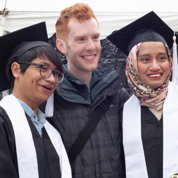 Academic Advisor Brendan Griffiths and two graduates