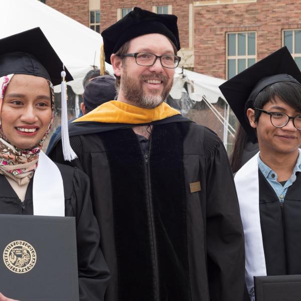 Professor Jeff Cameron and two graduates