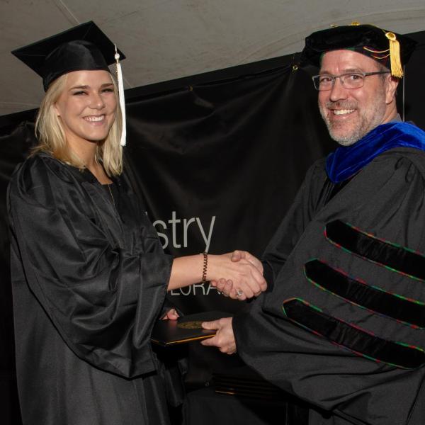 Chair, Jim Goodrich and Dominika Kovar, BA