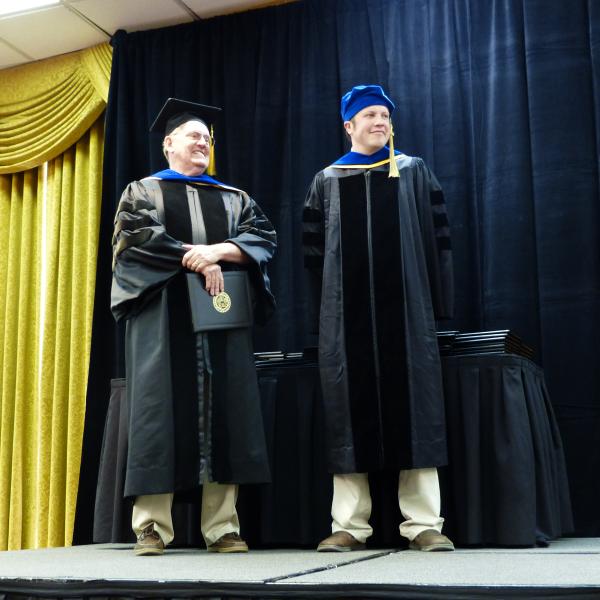 Chair, Carl Koval and Ph.D. graduate Adam Csakai