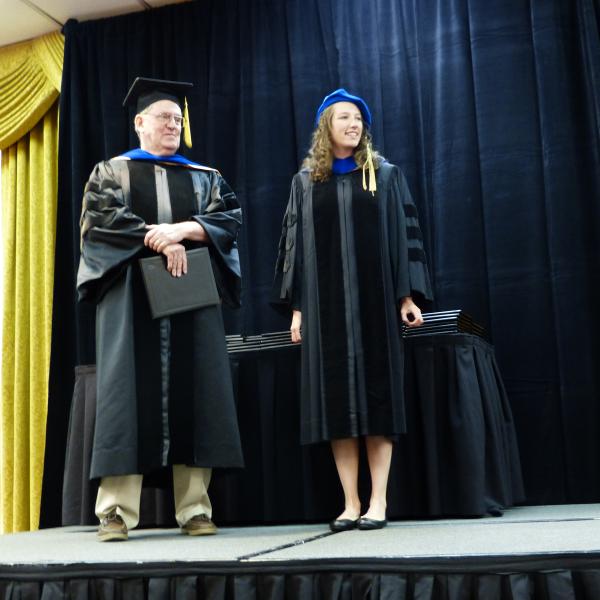 Chair, Carl Koval and Ph.D. graduate Ashley Marshall