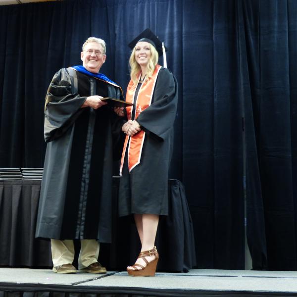 Chair, Carl Koval, congratulating undergraduate student_19