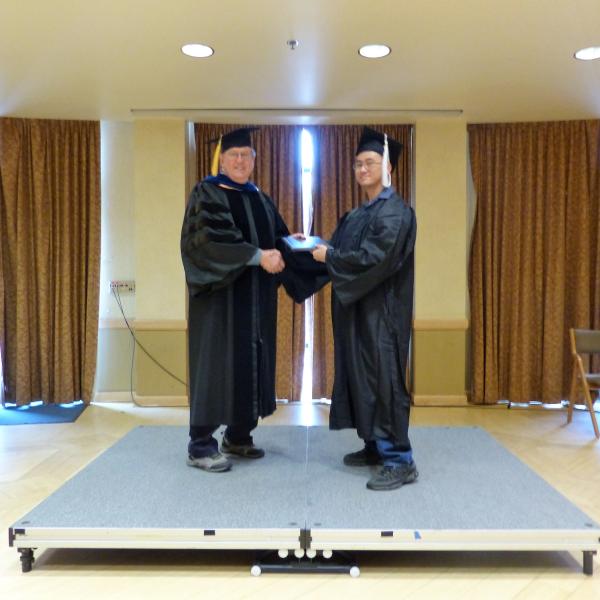 Undergrad Shaking Hands with Chair 2
