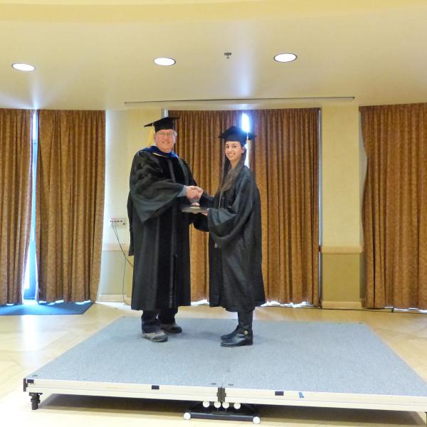 Undergrad Shaking Hands with Chair 4