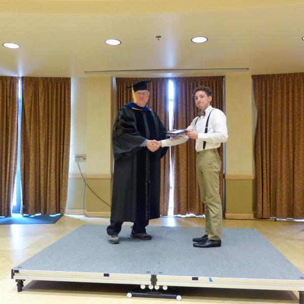 Undergrad Shaking Hands with Chair 5