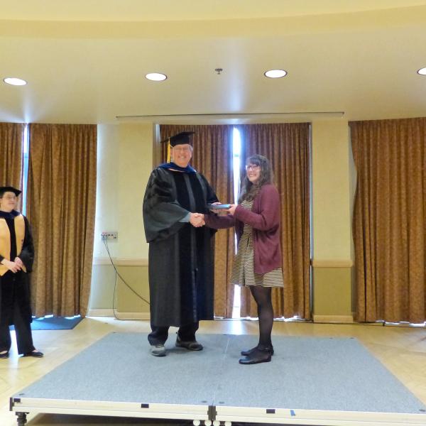 Undergrad Shaking Hands with Chair 6