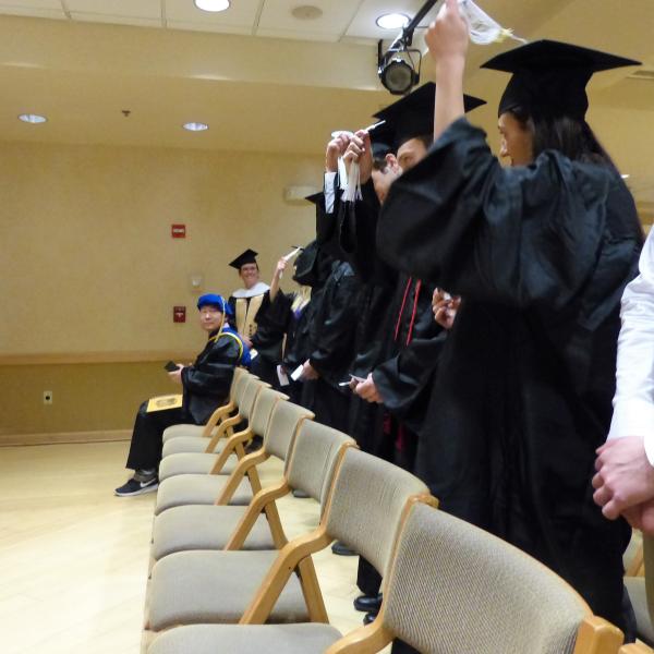 PhD Grad Shaking  Chair's Hand