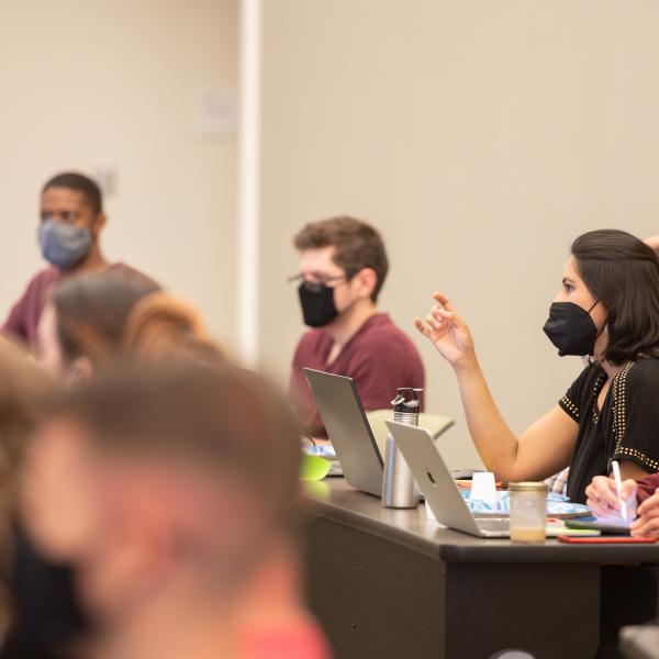 A group of students in a classroom with computers