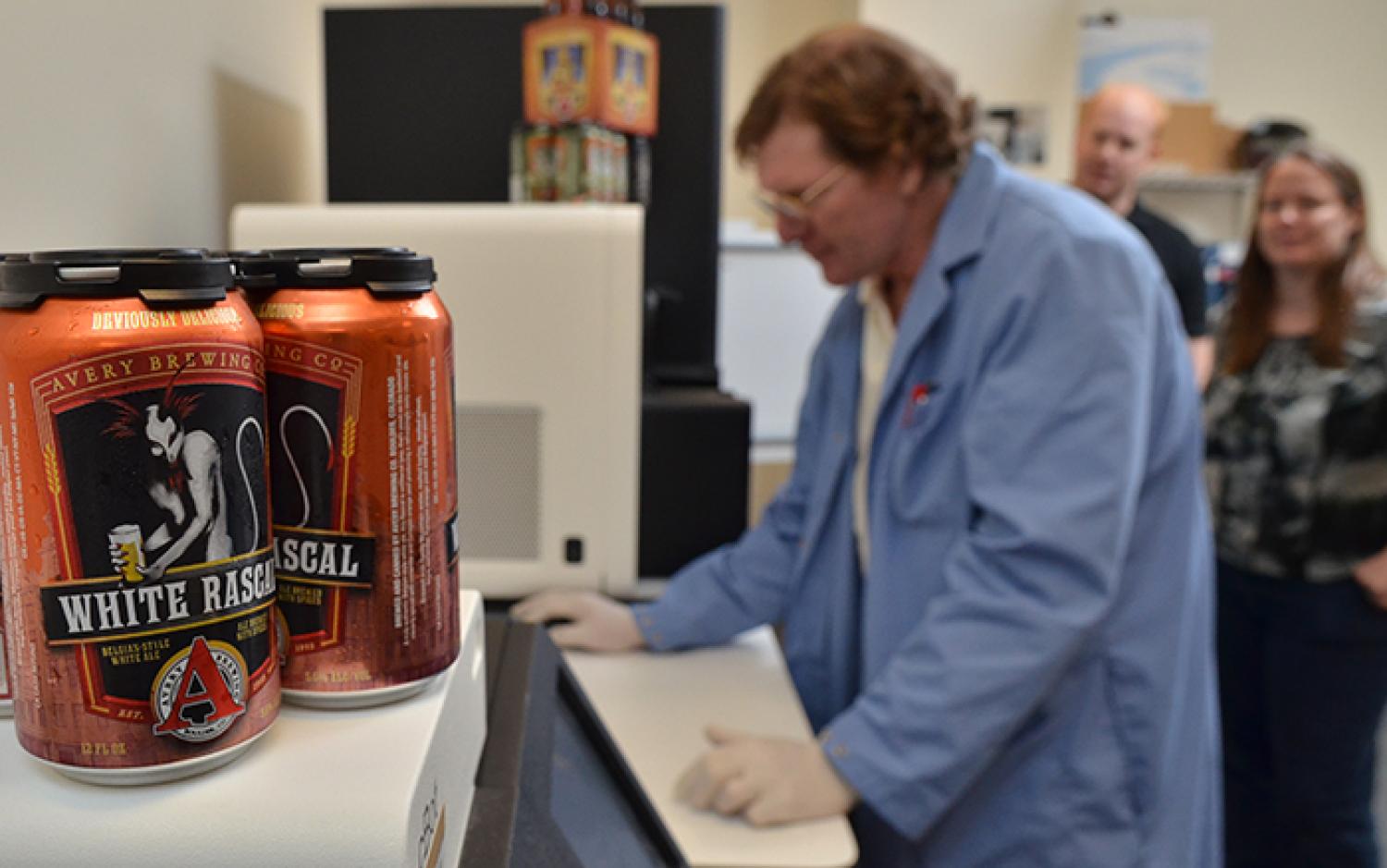 Huntley, Dowell and Driscoll work in the Sequencing Facility (Photo: Casey Cass)