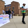 Students on the CU Boulder Campus with a colorfully lettered sign saying "Happy World Down Syndrome Day! March 21"