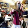 Ryan Doptis handles one of the pythons in Leslie Leinwand's lab. Doptis, an MCD Biology major, graduated in December. (Image: Cliff Grassmick)