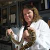 Biofrontiers scientist, Leslie Leinwand holds a Burmese python in her lab. Image by: Thomas Cooper