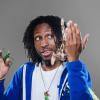 Sammy Ramsey holding a praying mantis and moth