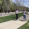 Volunteers, part of the Utah HERO project, walk down a neighborhood path.