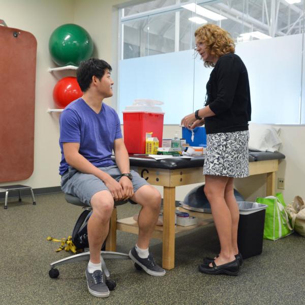 Student receiving flu vaccination at a clinic