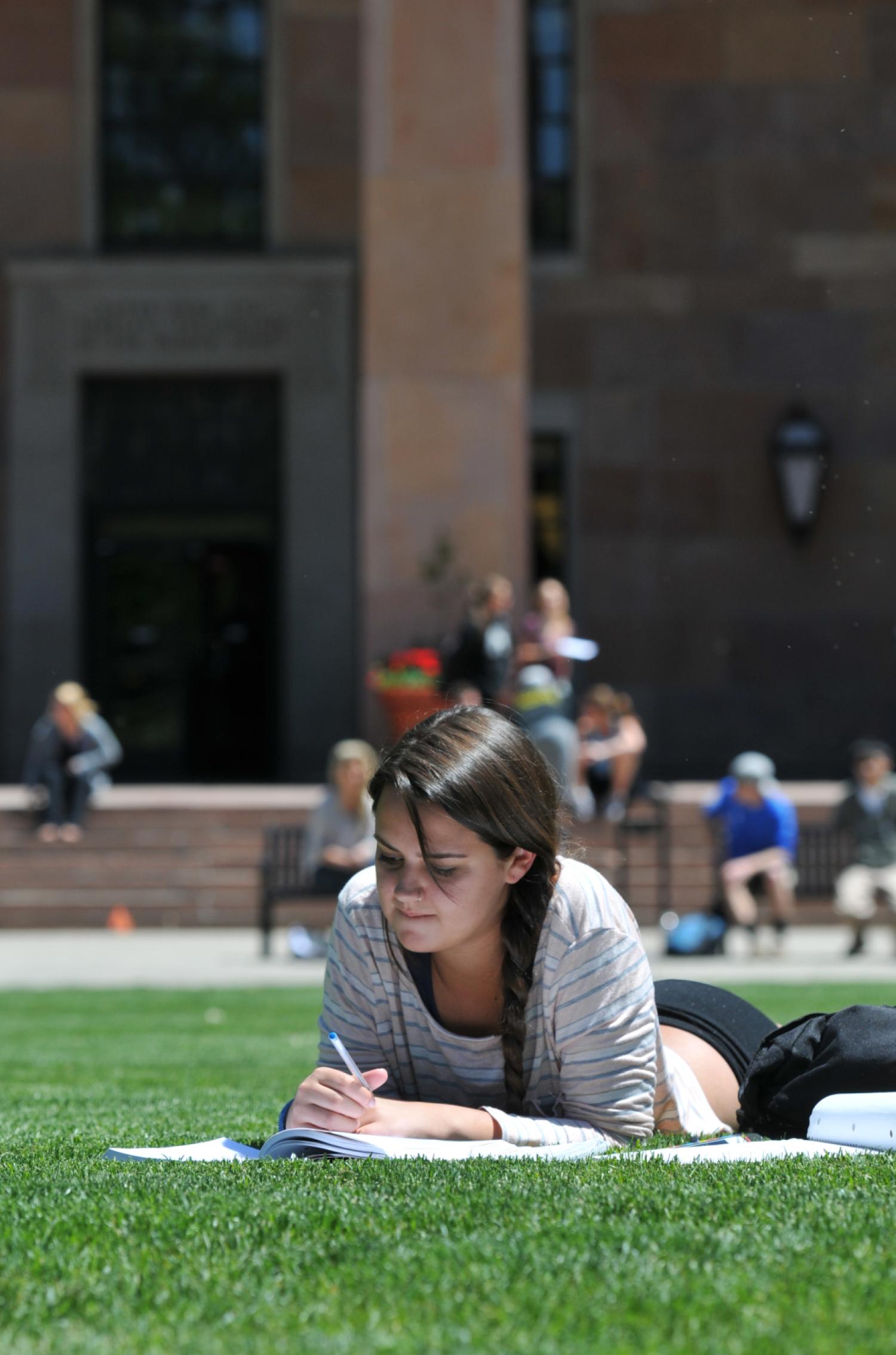 CU Boulder Student Studying on Norlin Quad