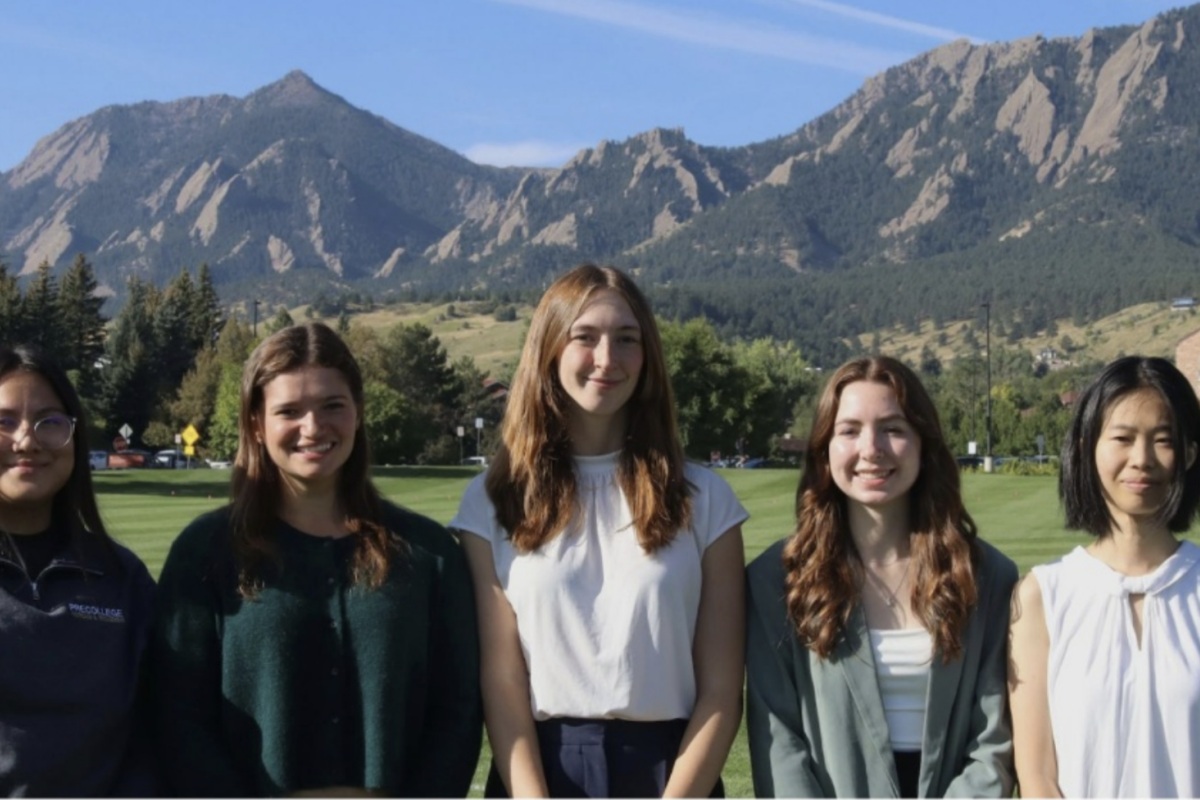 Five students in front of the flatirons