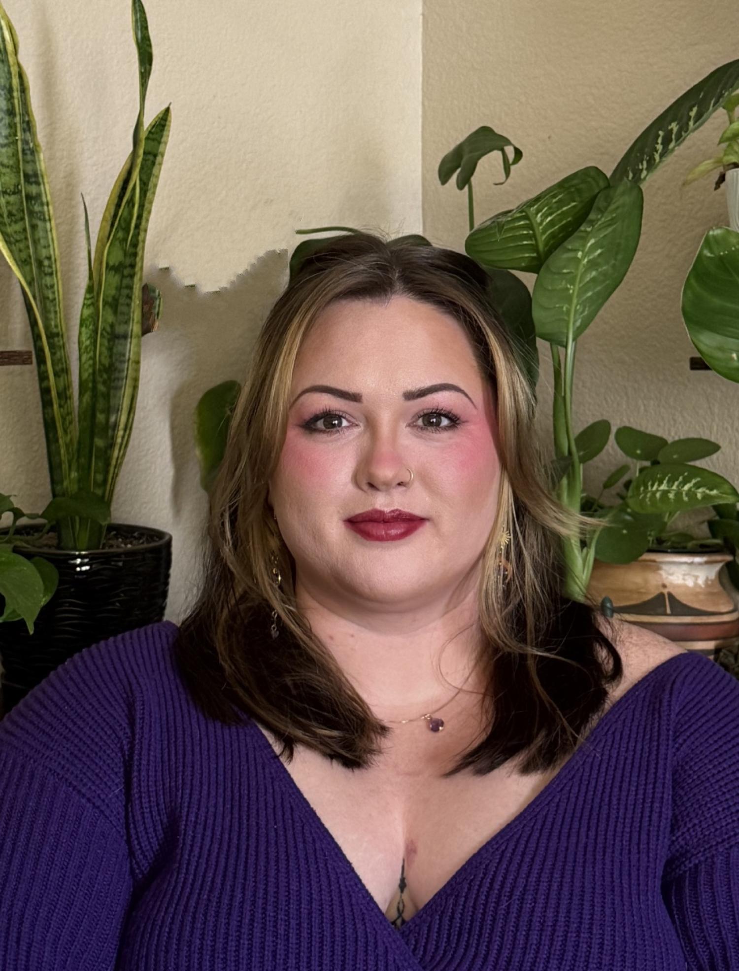 Headshot of person with purple blouse